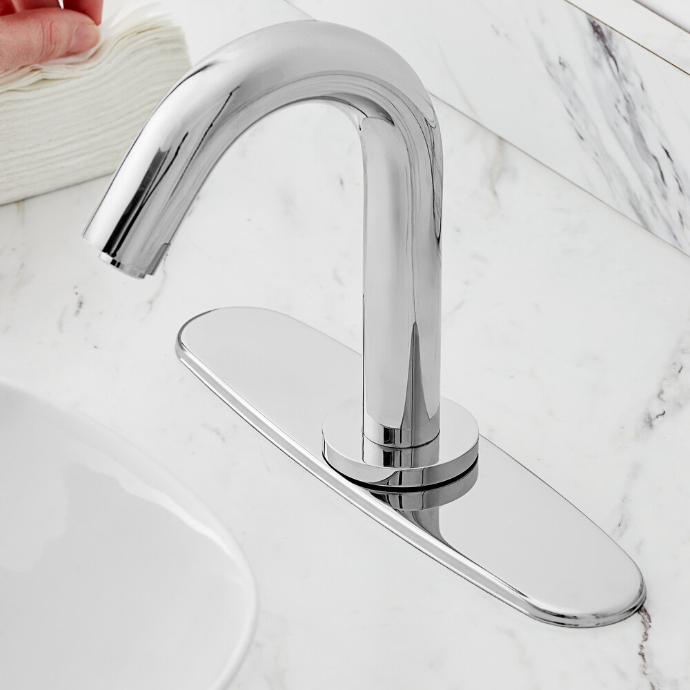 a silver rectangular object with a hole in the middle